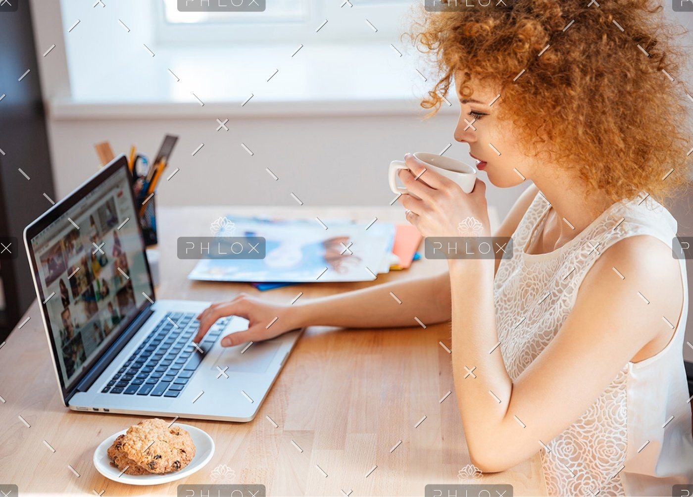 demo-attachment-1146-woman-photographer-drinking-coffee-and-working-PJNBP6U